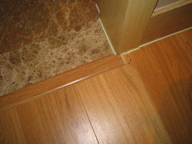 木地板和瓷砖接缝处打什么胶_瓷砖木地板接缝_瓷砖与木地板接缝